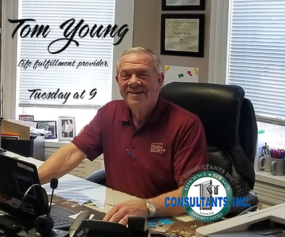 Thomas W. Young seated at his desk